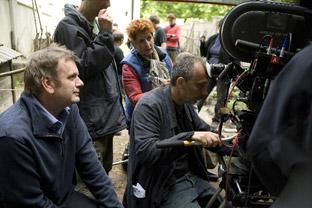 Mark Herman, left, at work with his film crew.