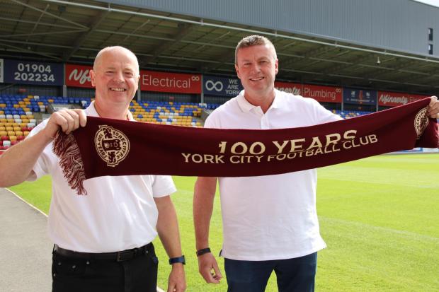 York City's new chief executive Alastair Smith (left) and chairman Glen Henderson (right) pose at the LNER Community Stadium. Picture: York City FC