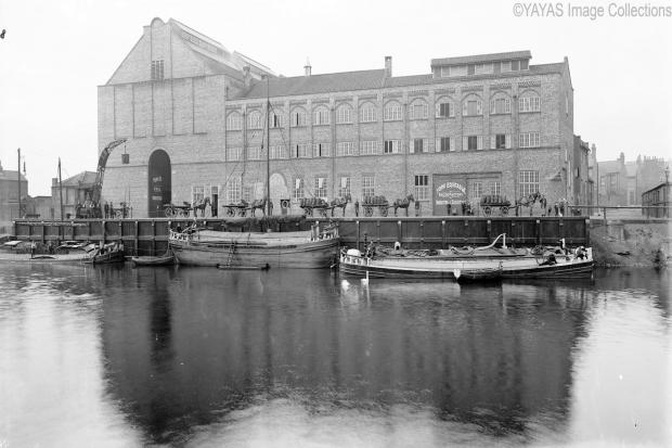 The premises of the York Equitable Industrial Society seen from across the river in 1909. The large covered coal depot is on the left. Boats are lined up ready to disgorge their cargo. Picture:YAYAS. From Made In Clementhorpe