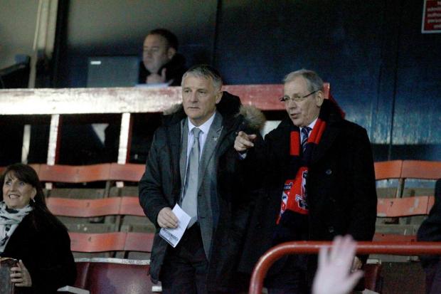 Former York City sporting director Dave Penney (left) takes his seat at Bootham Crescent. Picture: Gordon Clayton