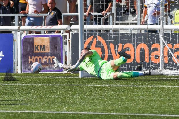 York City goalkeeper Ethan Ross saves a penalty in the first half. Picture: Tom Poole