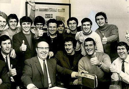 25/01/71: City players listen to the FA Cup draw with secretary George Teasdale. If York had beaten Southampton in the fourth round replay, they would have faced Bill Shankley's Liverpool team at Anfield. City lost 2-3.