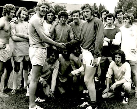 22/07/72: York City new signing Jimmy Seal (right), watch by other City players, is greeted by skipper Barry Swallow.