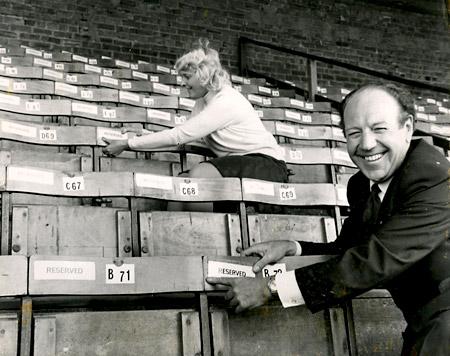 11/06/74 - All main stand seats had been sold for the following season after York City gained promotion to the then Second Division. 2,000 extra seats were being added to the Popular Stand. Pictured are George Teasdale (club secretary) and Susan Garrod