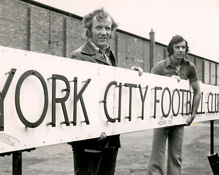 Three Portakabins were delivered to Bootham Crescent to provide extra office space. The club sign had to be removed to allow delivery. Colin Meldrum (club coach) and centre forward John Peachey are the strong men.