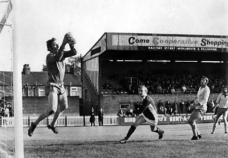 29/09/73: York City 3, Aldershot 1 - Aldershot 'keeper Tony Godfrey collects a hard centre as York City forward Jimmy Seal races in to challenge.