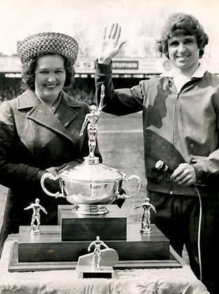 27/04/74: York City 1, Oldham 1 - Full back Phil Burros receives the Bill Fenton Memorial Trophy, the club's player of the year award, from Mrs Margo Fenton, widow of the former City outside left Bill Fenton.