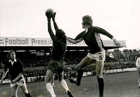 24/11/73 - York City 0, Mansfield Town 0, FA Cup 1: Arnold the Manfield keeper cuts out a high cross before Barry Swallow can make contact.