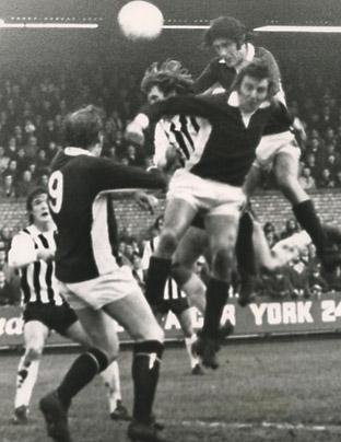 26/12/73: York City 1, Grimsby Town 1 - Chris Topping gets above Chris Jones and a Grimsby defender and heads towards goal only to see goalkeeper Harry Wainman save.
