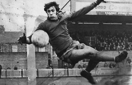 5/1/74 - York City 2, Rochdale 1: Rochdale 'keeper Mike Poole makes a spectacular flying leap to nudge a shot from York City's Barry Lyons round the near post.