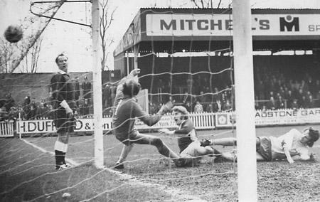 14/02/76 - York City 1, Carlisle United 2: One that didn't count... Barry Swallow, the City skipper, heads the ball past Carlisle 'keeper Tom Clark only to have his effort disallowed.