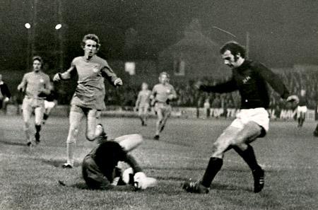 12/10/73 - York City 1, Wrexham 0: Goalkeeper Brian Lloyd, goes down to save at the feet of City centre forward John Peachey.