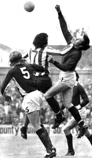 03/11/73: Brighton 0, York City 0 - Goalkeeper Graeme Crawford punches clear from the head of Brighton player Ken Beamish, with Barry Swallow in support.