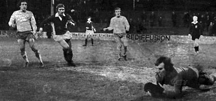 10/12/73 - Mansfield Town 5, York City 3: Mansfield goalkeeper Graham Brown goes down to save at the foot of the post with Chris Jones coming in.