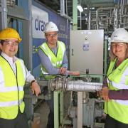 From left, Kentaro Hosomi, of Mitsubishi Heavy Industries; , with Carl Clayton, head of BECCS, and Jenny Blyth, project analyst, at Drax Group, pictured at Drax Power Station.