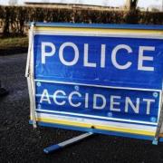 A police accident sign