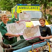 Yormed ambulance technicians Ashley Mason, left, Danny Watt and trainee Chris Chadwick, right, with the Life Savers vehicle signs