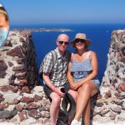 Claire and Steve Potter pictured on Santorini after getting on their Med cruise at the second attempt and (inset) on the plane before their first flight was aborted