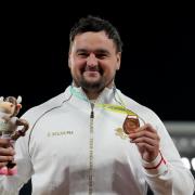 City of York Athletics Club star Scott Lincoln poses with his 2022 Commonwealth Games shot put bronze medal. Picture: Martin Rickett/PA Wire