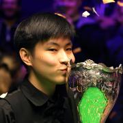 Snooker star Zhao Xintong celebrates winning the 2021 Cazoo UK Championship title. Picture: Richard Sellers/PA Wire