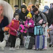 York launches new appeal for host families as war in Ukraine drags on. Pictured: refugees, including children, wait for transport after fleeing to Poland from the war in  Ukraine. Inset: Rebecca Russell of York City of Sanctuary