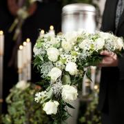 Funeral flowers and mourning candles