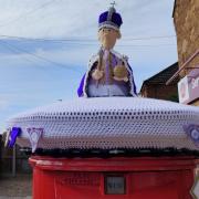 Strensall WI's knitted King Charles III at Huntington Post Office
