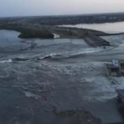Water pouring through the breached Kakhovka dam in Kakhovka, Ukraine.  Russian forces have been accused of blowing up the dam
