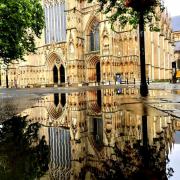 Rain surface reflections of the Minster