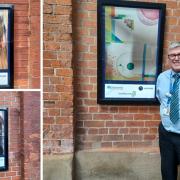 Station manager Richard Isaac with some of the new artworks now hanging at Beverley Station