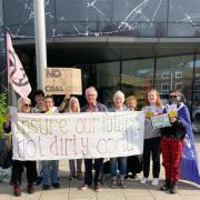 Members of Extinction Rebellion (XR) York gathered outside the HISCOX building