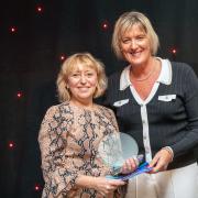 Ann Warriner being presented the Health Service Hero award by Lucy Stoakes