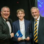 Chris Marsden and Jonathan Cowap from YO1 radio present the Spirit of Youth award to Lucas Hughes
