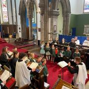 The choir performs in the church