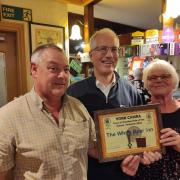 Phil and Sue Robinson with Chris Tregellis of Camra in he centre