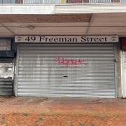 Shuttered shops on Freeman Street, where over 30 units stand vacant.