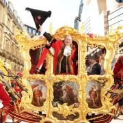 Michael Mainelli, the 695th Lord Mayor of the City of London, waves from the State Coach during the Lord Mayor's Show in the City of London