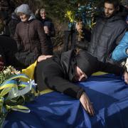 Tuesday, Dec. 26, 2023: Hanna Boichuk cries during the funeral ceremony of her son Vasyl Boichuk, a Ukrainian serviceman who was killed in Mykolayiv in March 2022