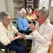 Glen Booth entertaining the residents of Meadowbeck care home dressed as Elvis Presley