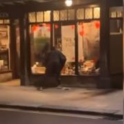A still from the video of the smash and grab at the York Gin shop