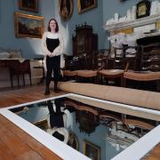 Evie Andrews (pictured) said mirrors on the floor of a Fairfax House room help show off the stucco ceiling