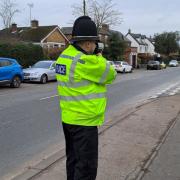 An officer with a speed camera