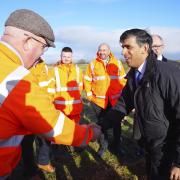 Prime Minister Rishi Sunak speaks to Network Rail employees as he visits a location on the site of the future Haxby railway station near York