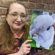 Fiona Brown with a painting of her beloved late rabbit Canape. Fiona is helping to launch a new pet bereavement cafe at The Yorkshire Barn, Murton