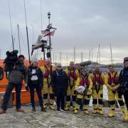 The Songs of Praise filming crew with The Rev Canon Kate Bottley prepare to board Scarborough's Shannon Lifeboat for a special 200th anniversary episode