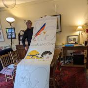 Terry Brett with the Good Rabbits Gone banner that will be on display outside the Pyramid Gallery, in Stonegate, York, on Friday