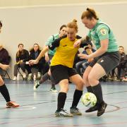 Jessica Baker (in green) on the ball with captain Ellie Whittaker looking on