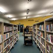 Acomb librarian Katie shelving books