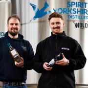 Joe Clark with the Filey Bay whisky and Henry Culpepper with the Rip Curl Porter