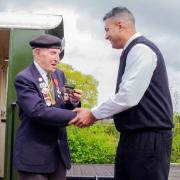 Normandy veteran Ken Cooke being [resented with his model of 'Rowntree No 3' at the Derwent Valley Light Railway